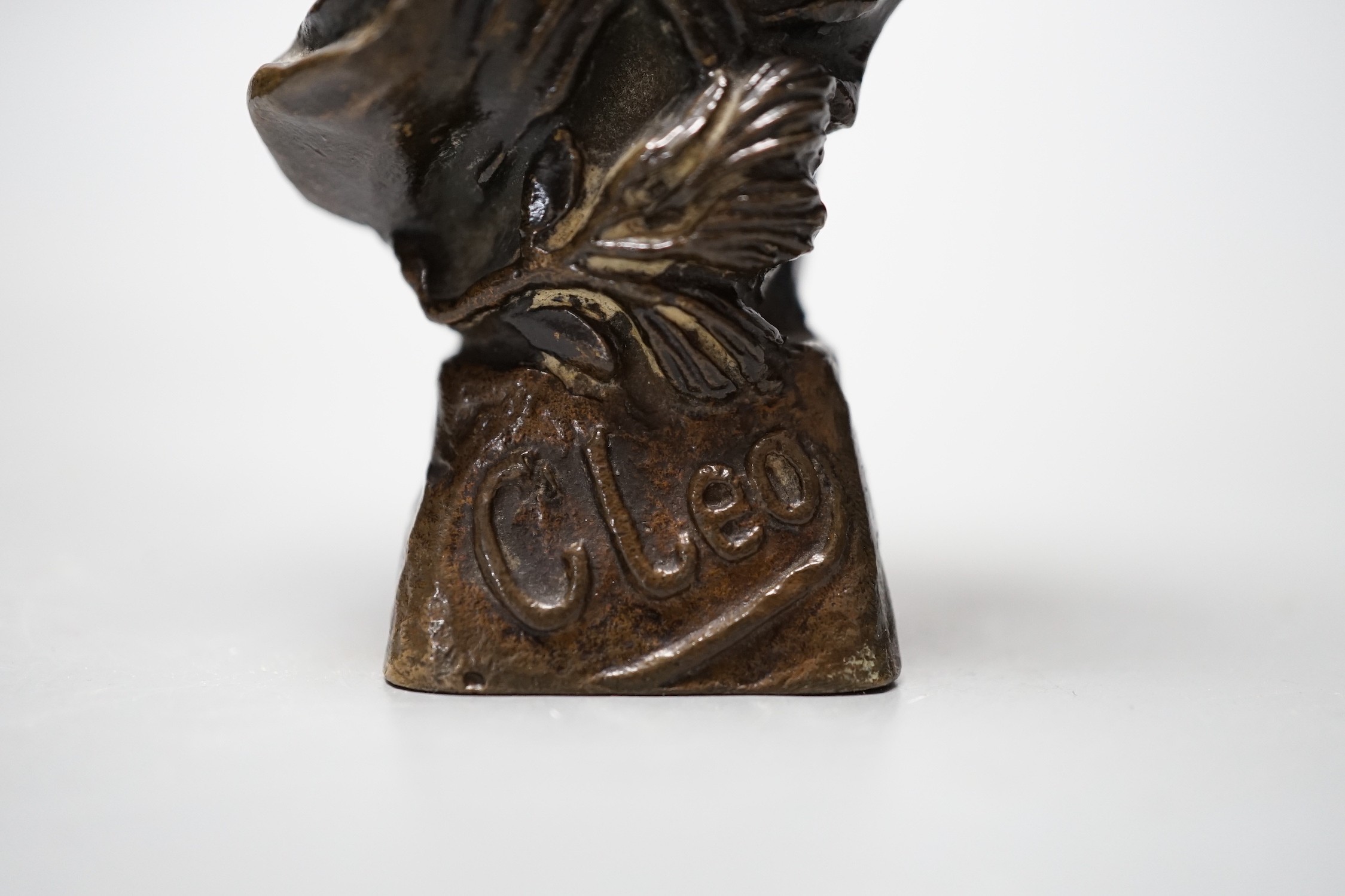 A small bronze bust marked ‘Cleo’, 11cm tall